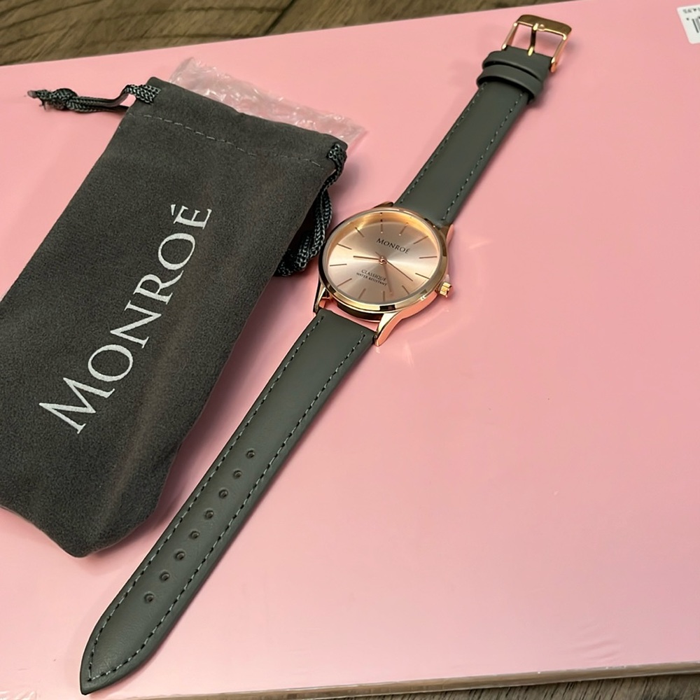 Monroe watch with charcoal leather band and rose gold face. Brand new